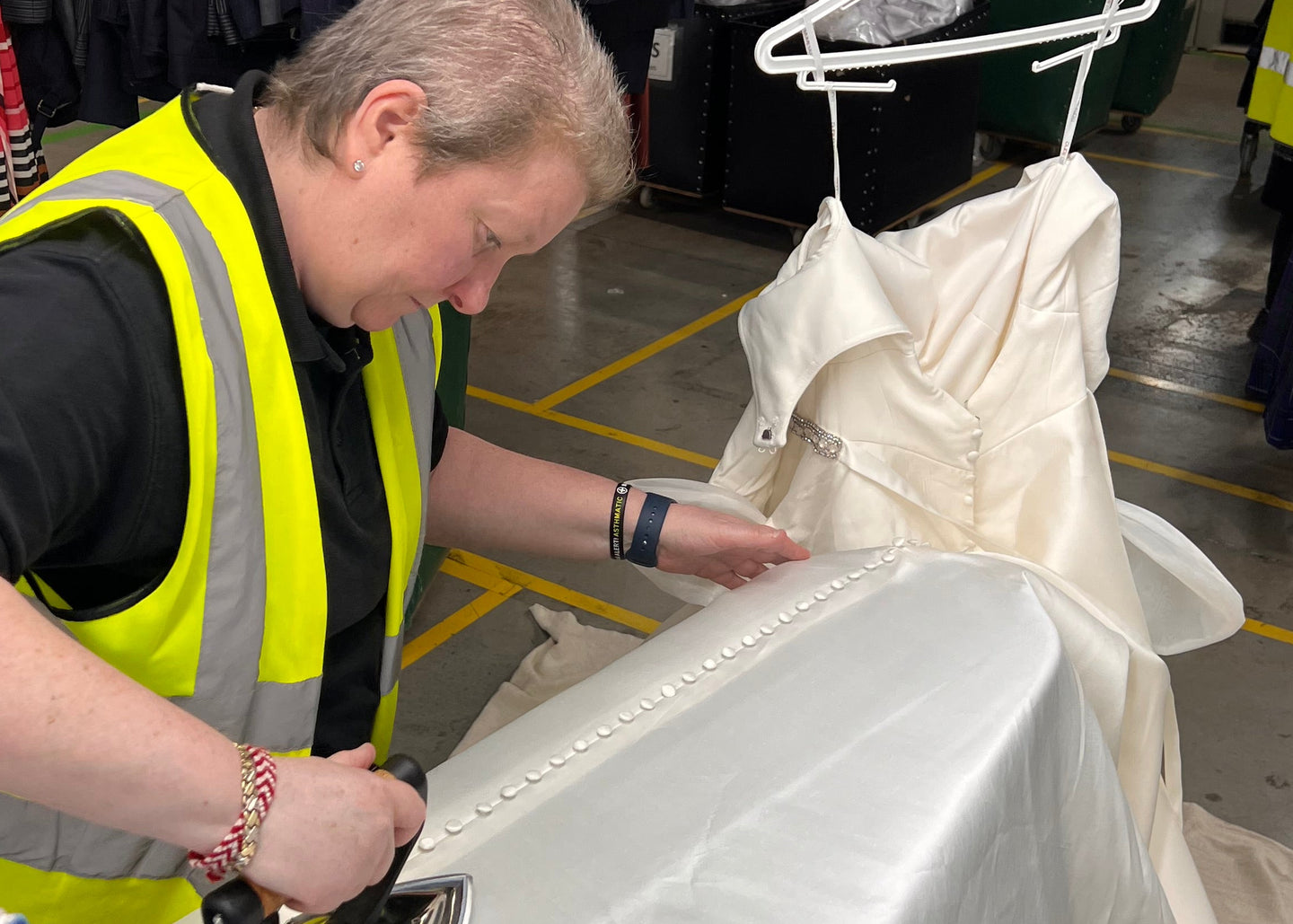 Dorothy Dress Cleaning Expert ironing a wedding dress